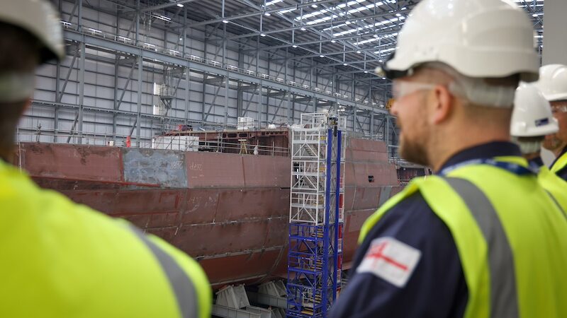 Men in hard-hats in factory